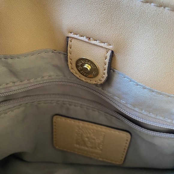 Anne Klein Engraved Lion Logo Gold-Tone Zippered Clutch - Picture 6 of 9